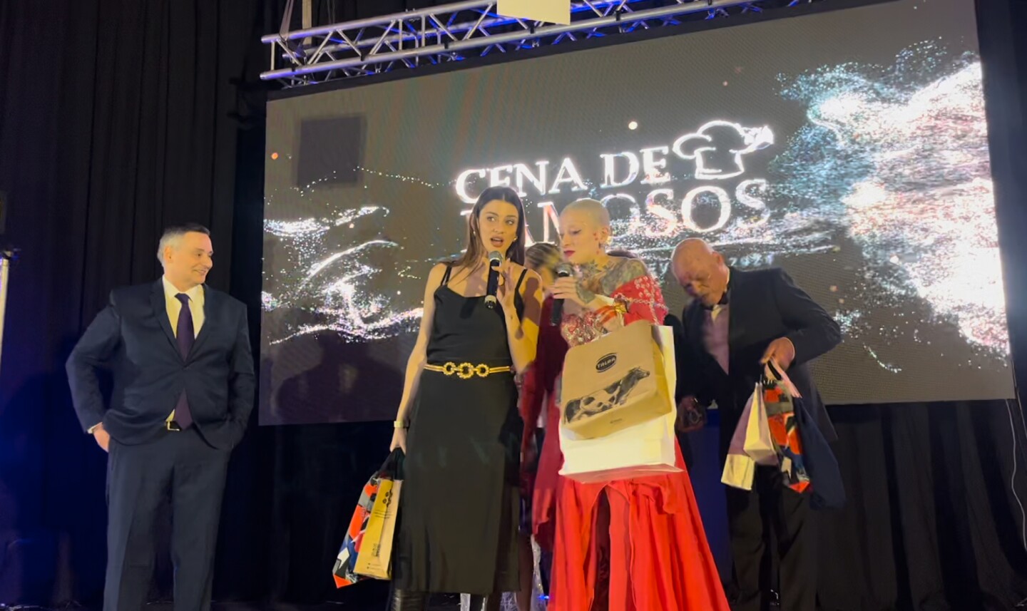 Eliana Dide and Furia on stage at the Celebrity Dinner.