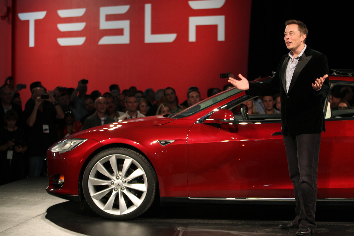 Tesla Motors CEO Elon Musk speaks next to the company's newest Model S during the Model S Beta Event held at the Tesla factory in Fremont, California October 1, 2011. The Model S is the company's first full-size electric sedan set for release in 2012. REUTERS/Stephen Lam (UNITED STATES - Tags: TRANSPORT BUSINESS LOGO SCIENCE TECHNOLOGY) - RTR2S40H