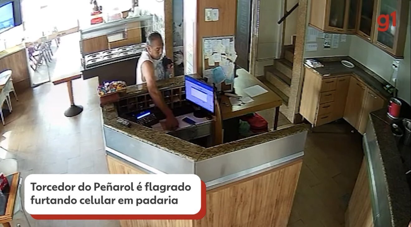 Captura de la televisión brasileña de un supuesto hincha de Peñarol robando en un comercio.