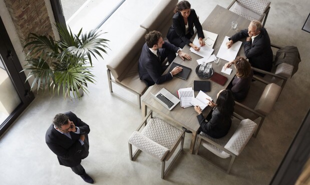 Team of financial advisors planning with business coworkers during meeting at law firm